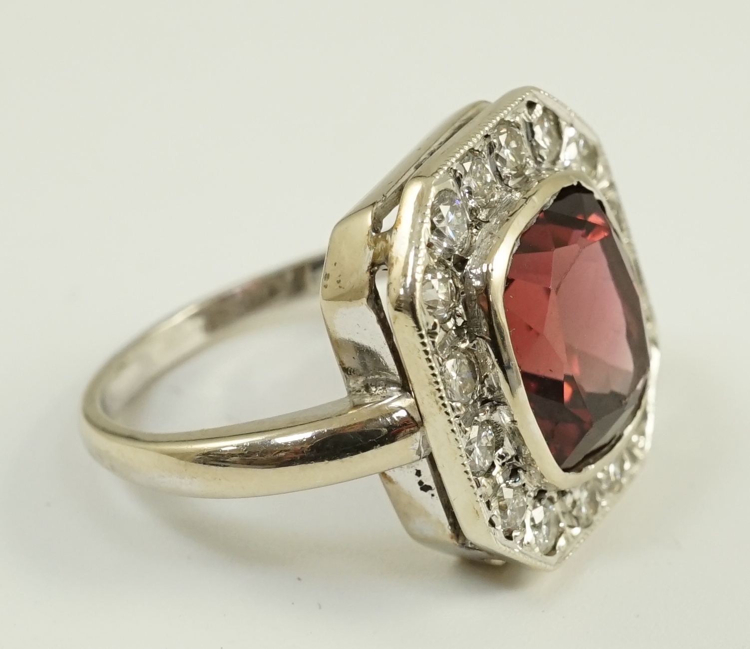 An 18ct white gold, tourmaline and diamond set octagonal dress ring